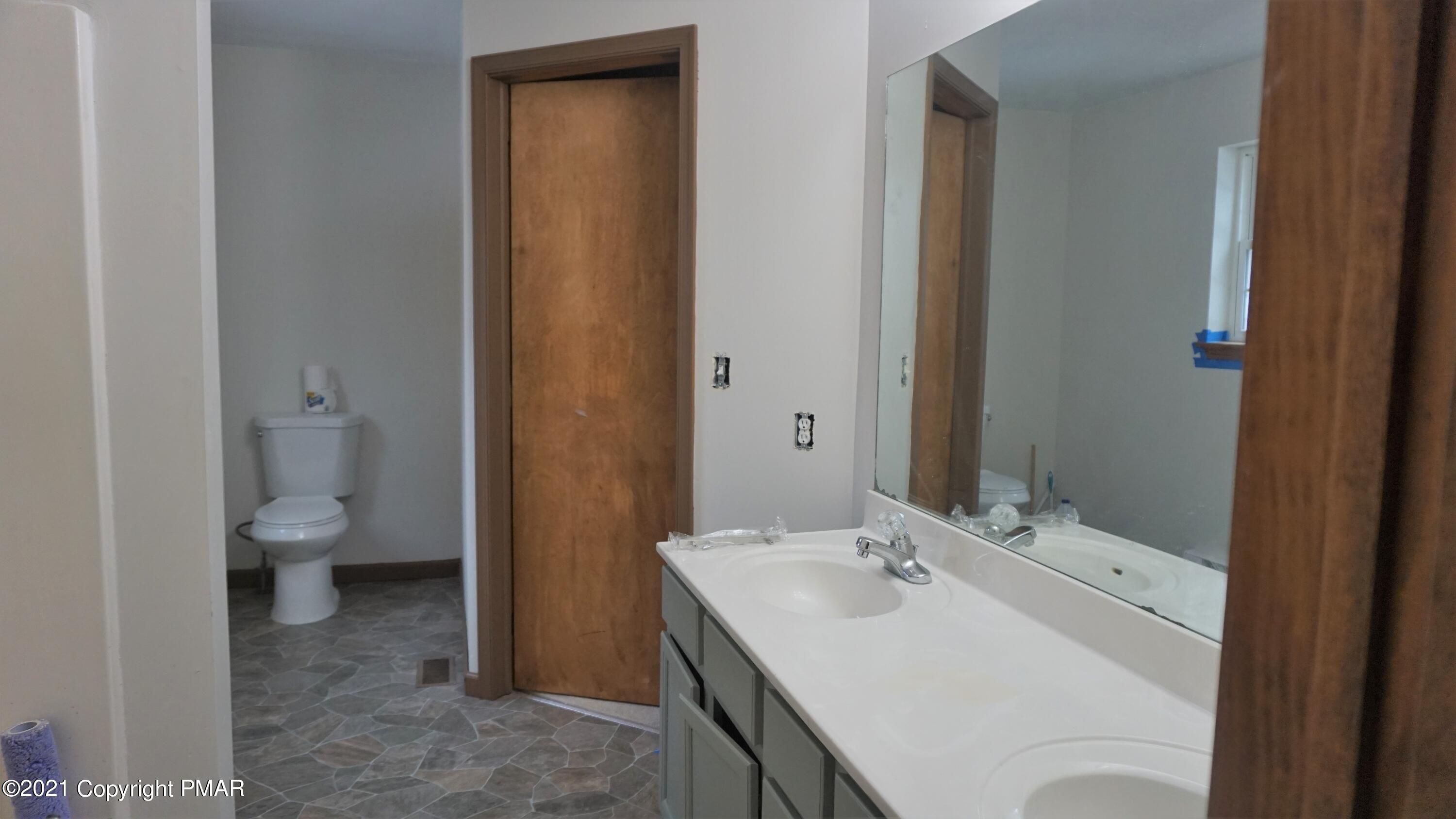 398 Gold Finch Road Bushkill, PA 18324 - Photo 14 of 24 a bathroom with a sink and a toilet