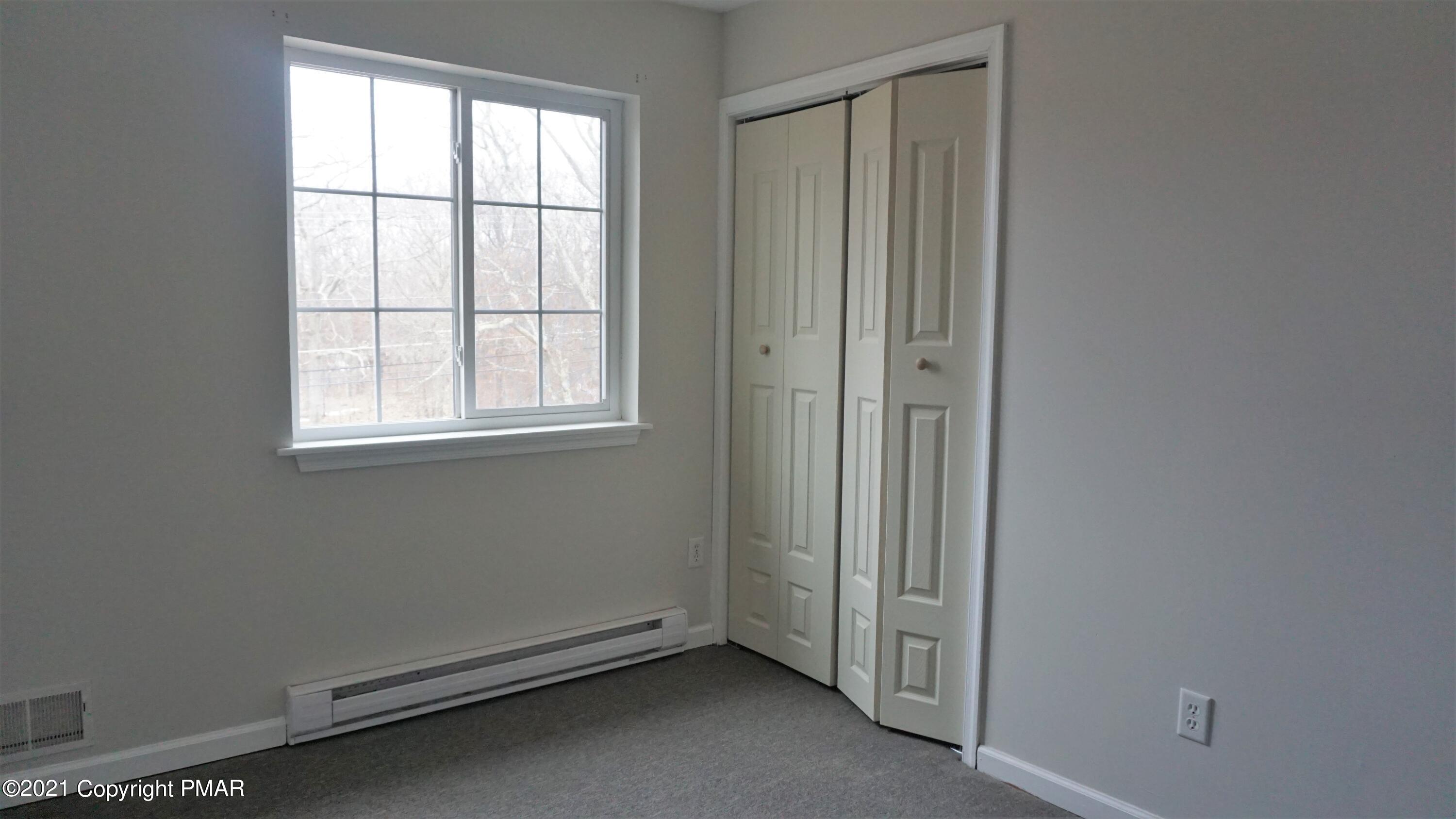 398 Gold Finch Road Bushkill, PA 18324 - Photo 17 of 24 an empty room with a window