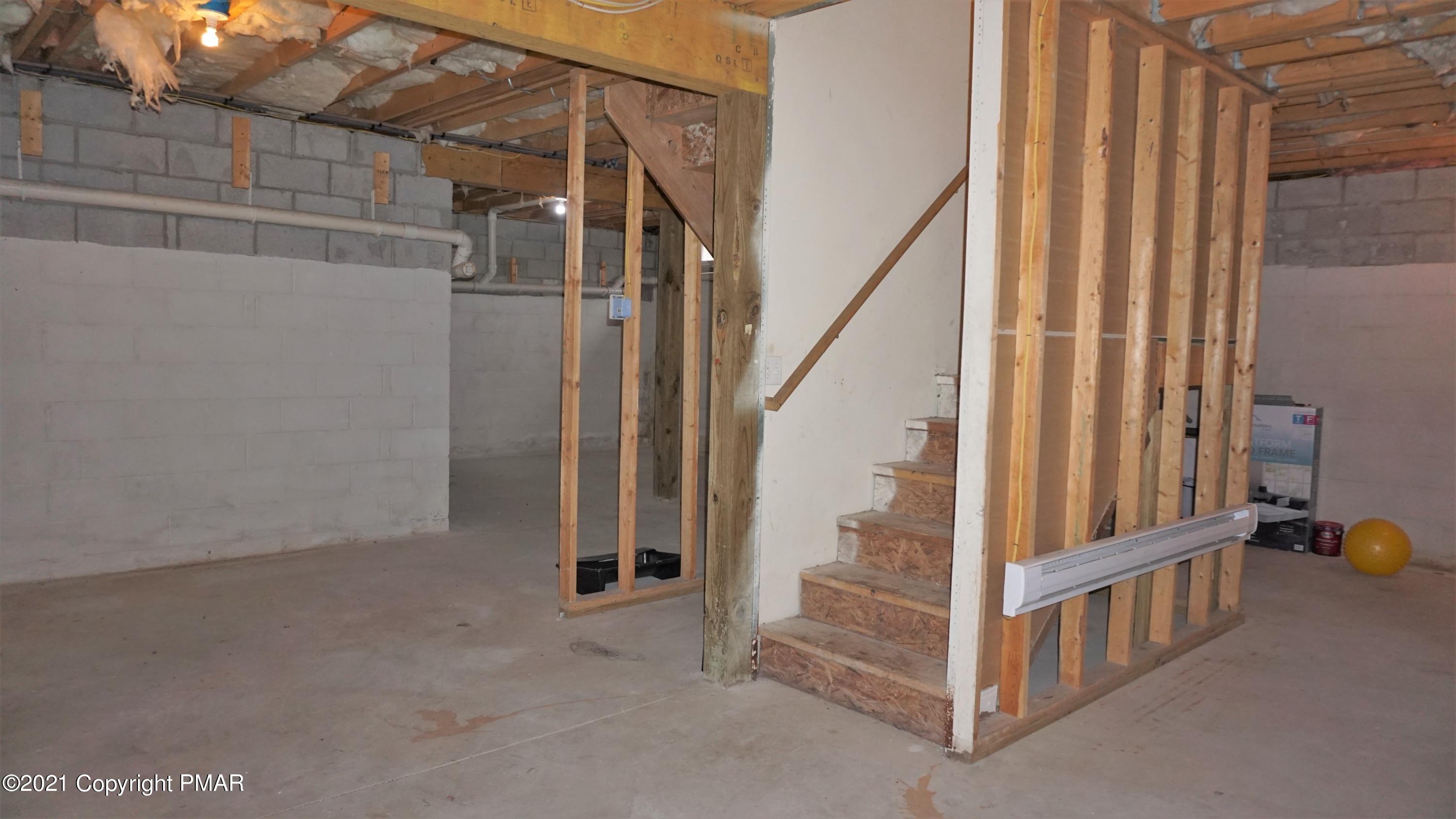 398 Gold Finch Road Bushkill, PA 18324 - Photo 22 of 24 a view of staircase with railing and white walls