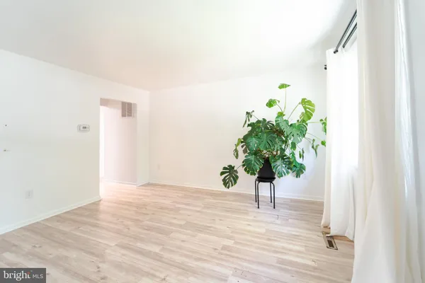 a view of kitchen with sink and cabinets