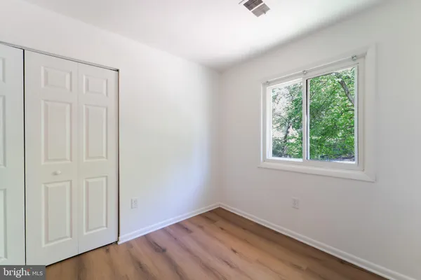 a bathroom with a shower and a toilet