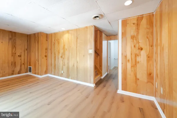 a bathroom with a sink and cabinets