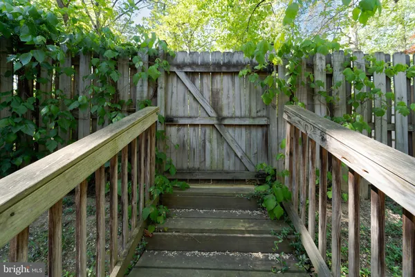 a view of a house with backyard and porch