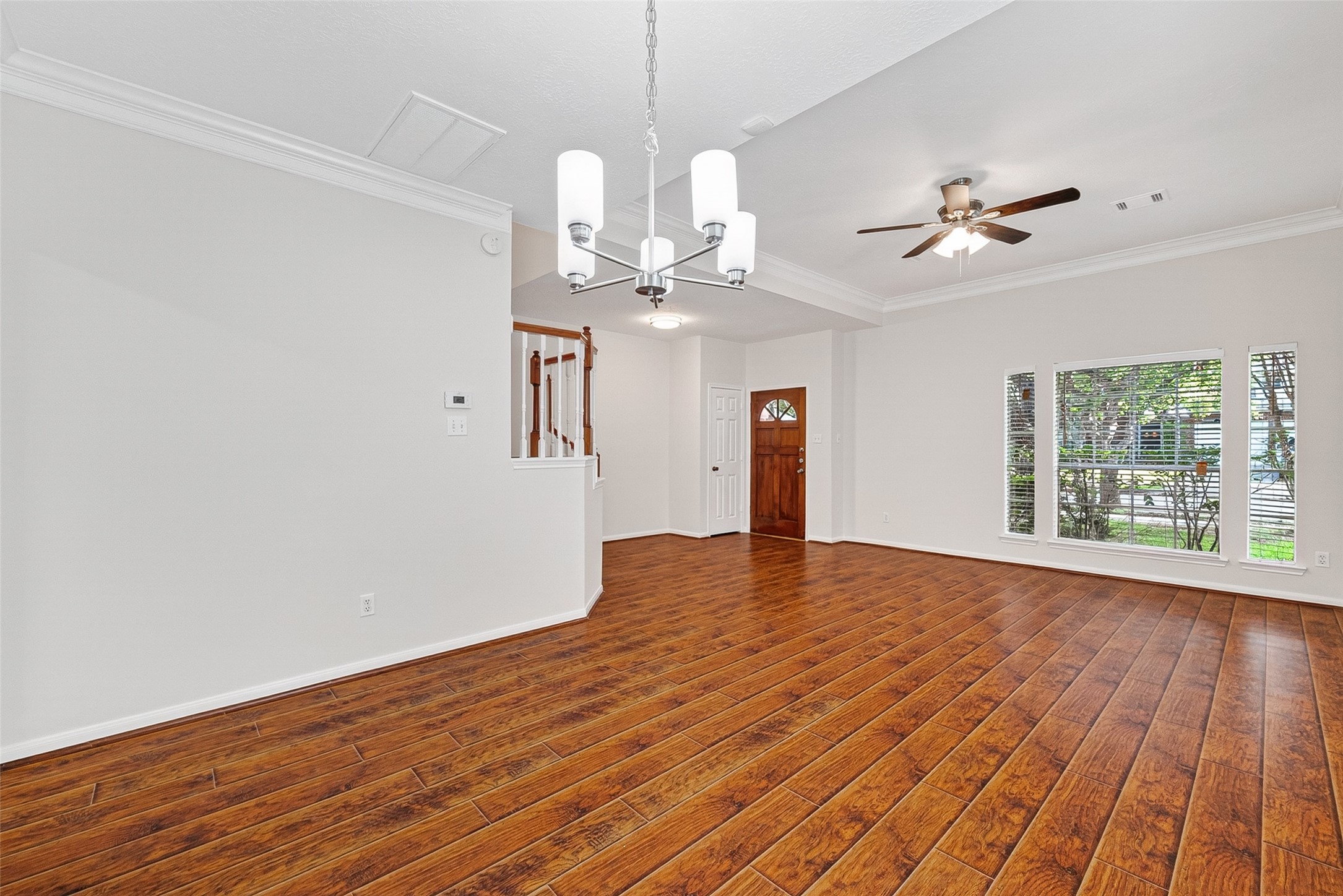 4539 Springfield Lakes Street Sugar Land, TX 77479 - Photo 13 of 34 a view of empty room with wooden floor and fan