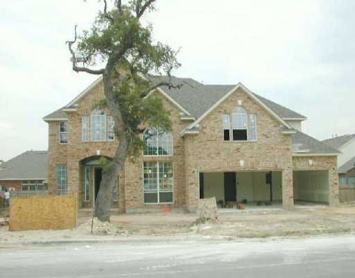 10308 Chestnut Ridge Road Austin, TX 78726 - Photo 1 of 1 a front view of a house with garden