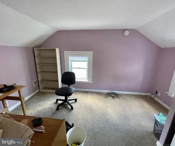 a view of workspace with lounge chair