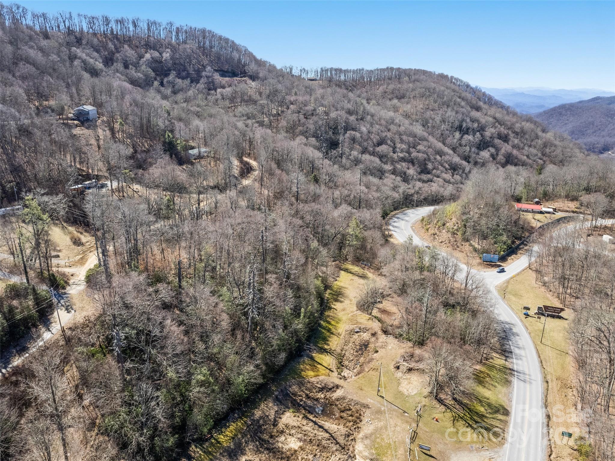 Lot 5 Spruce Flats Road Maggie Valley, NC 28751 - Photo 4 of 13 a view of a dry field with mountains in the background
