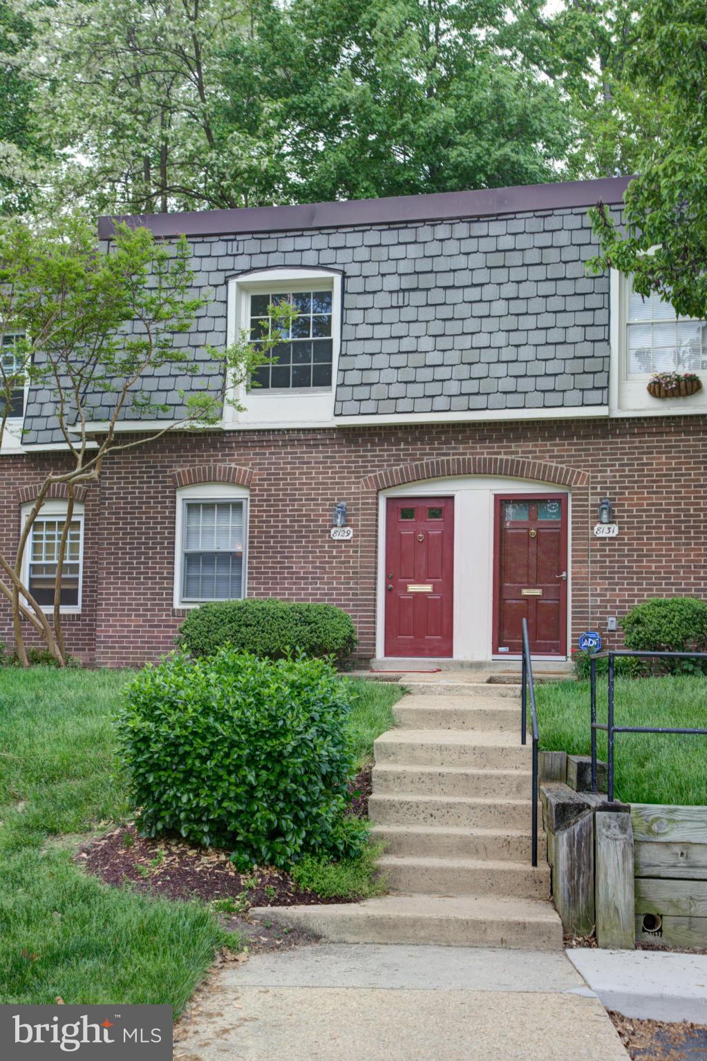8129 Kingsway Court, Unit 283 Springfield, VA 22152 - Photo 1 of 22 a front view of a house with garden