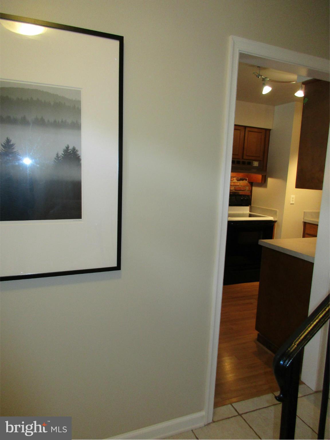 8129 Kingsway Court, Unit 283 Springfield, VA 22152 - Photo 13 of 22 a view of a hallway with wooden floor
