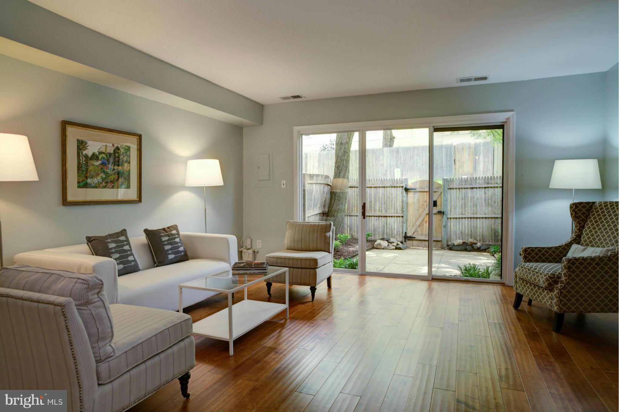 8129 Kingsway Court, Unit 283 Springfield, VA 22152 - Photo 2 of 22 a living room with furniture and a large window