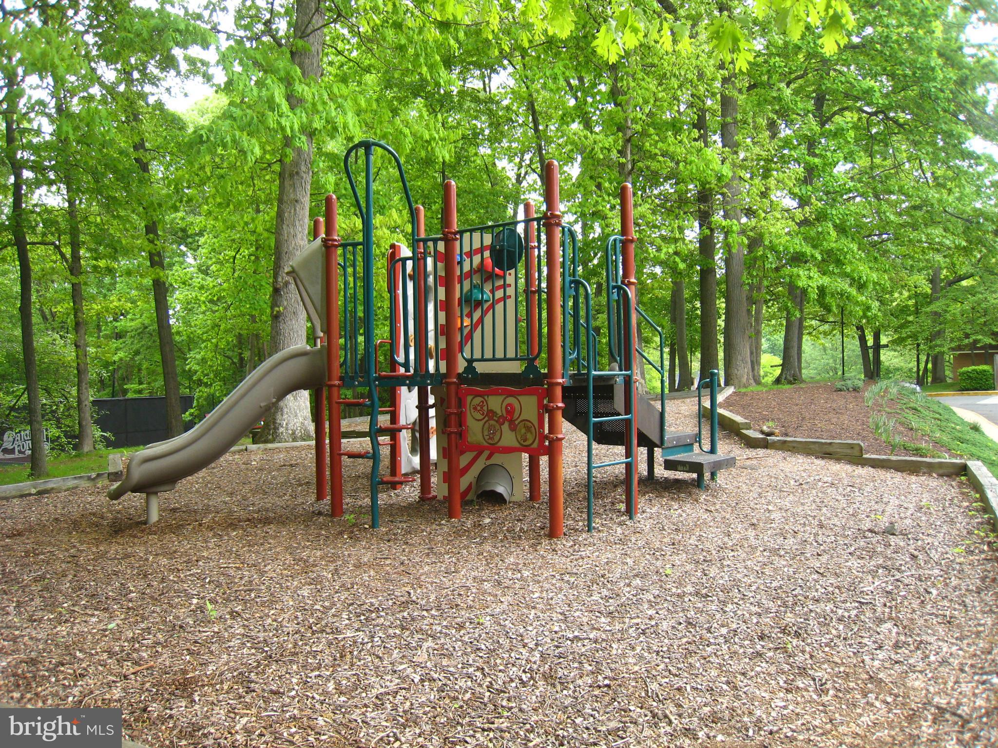 8129 Kingsway Court, Unit 283 Springfield, VA 22152 - Photo 21 of 22 a view of a park with swings and slides