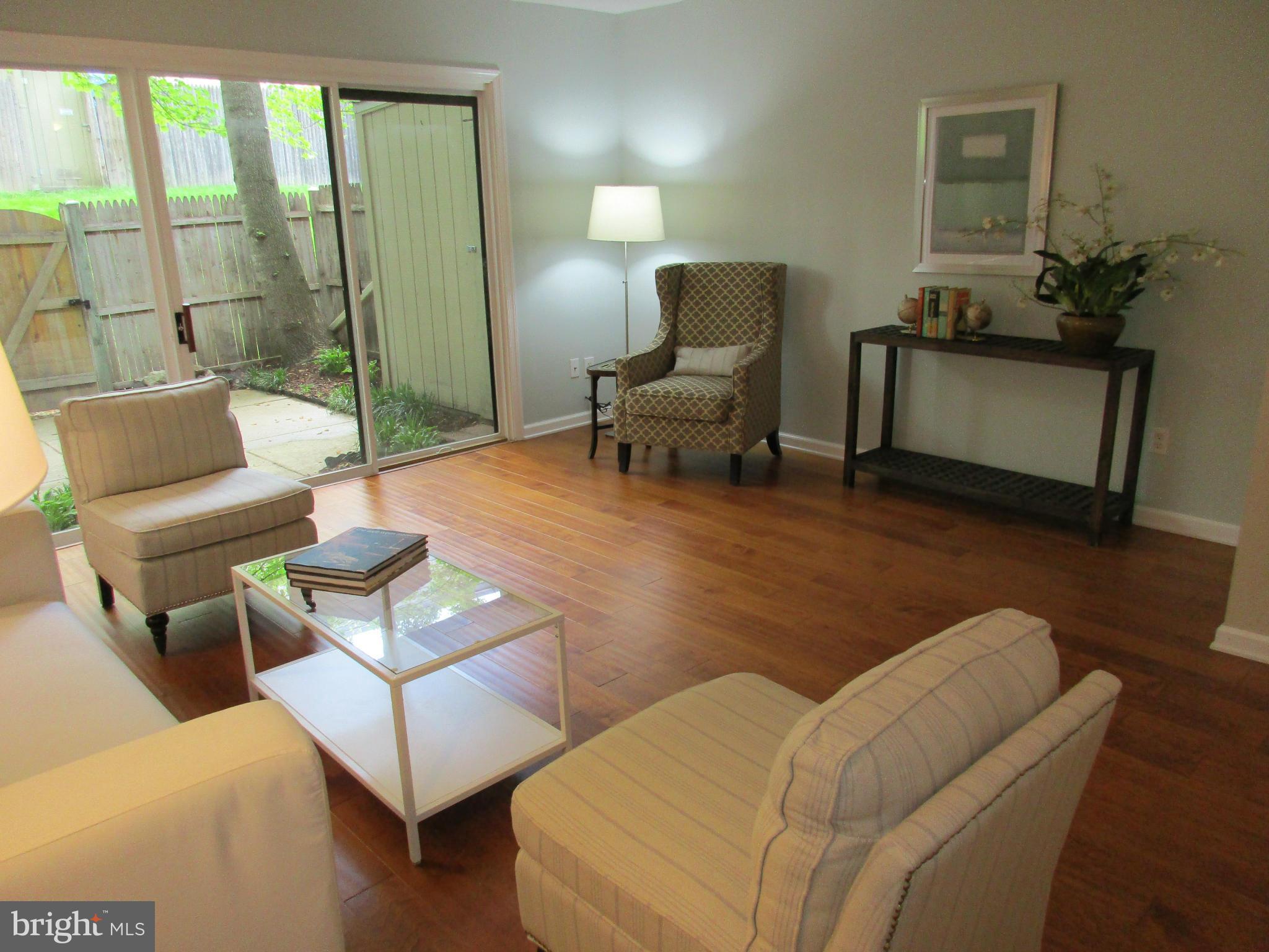 8129 Kingsway Court, Unit 283 Springfield, VA 22152 - Photo 3 of 22 a living room with furniture and a floor to ceiling window