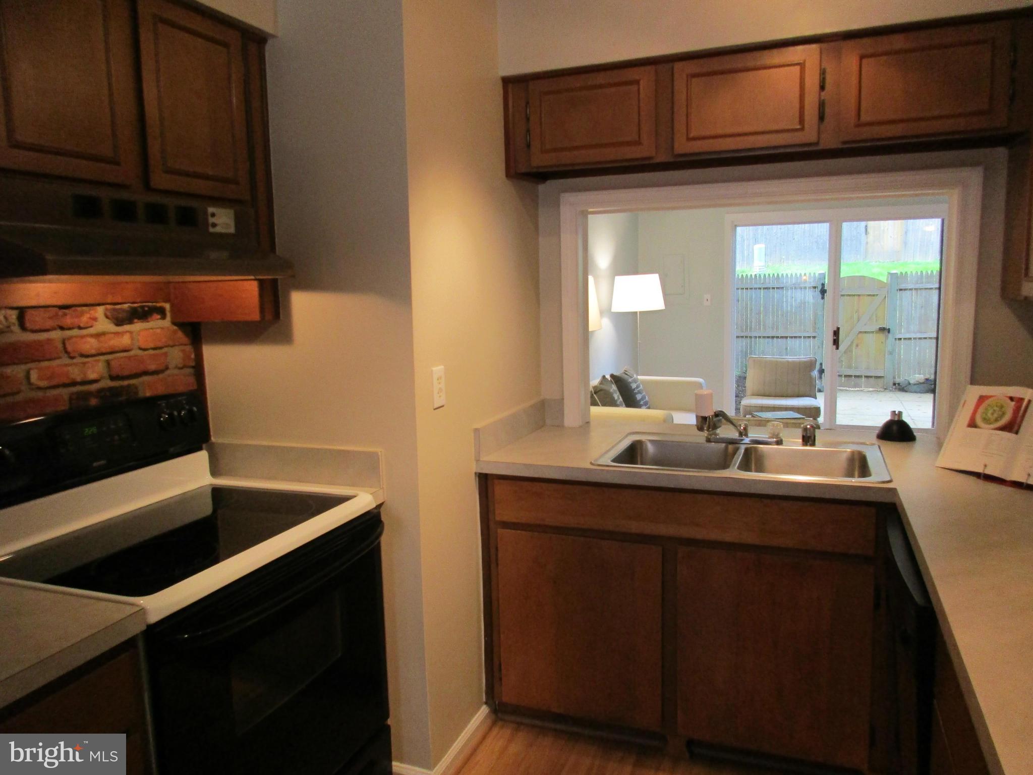 8129 Kingsway Court, Unit 283 Springfield, VA 22152 - Photo 8 of 22 a kitchen with a sink and cabinets