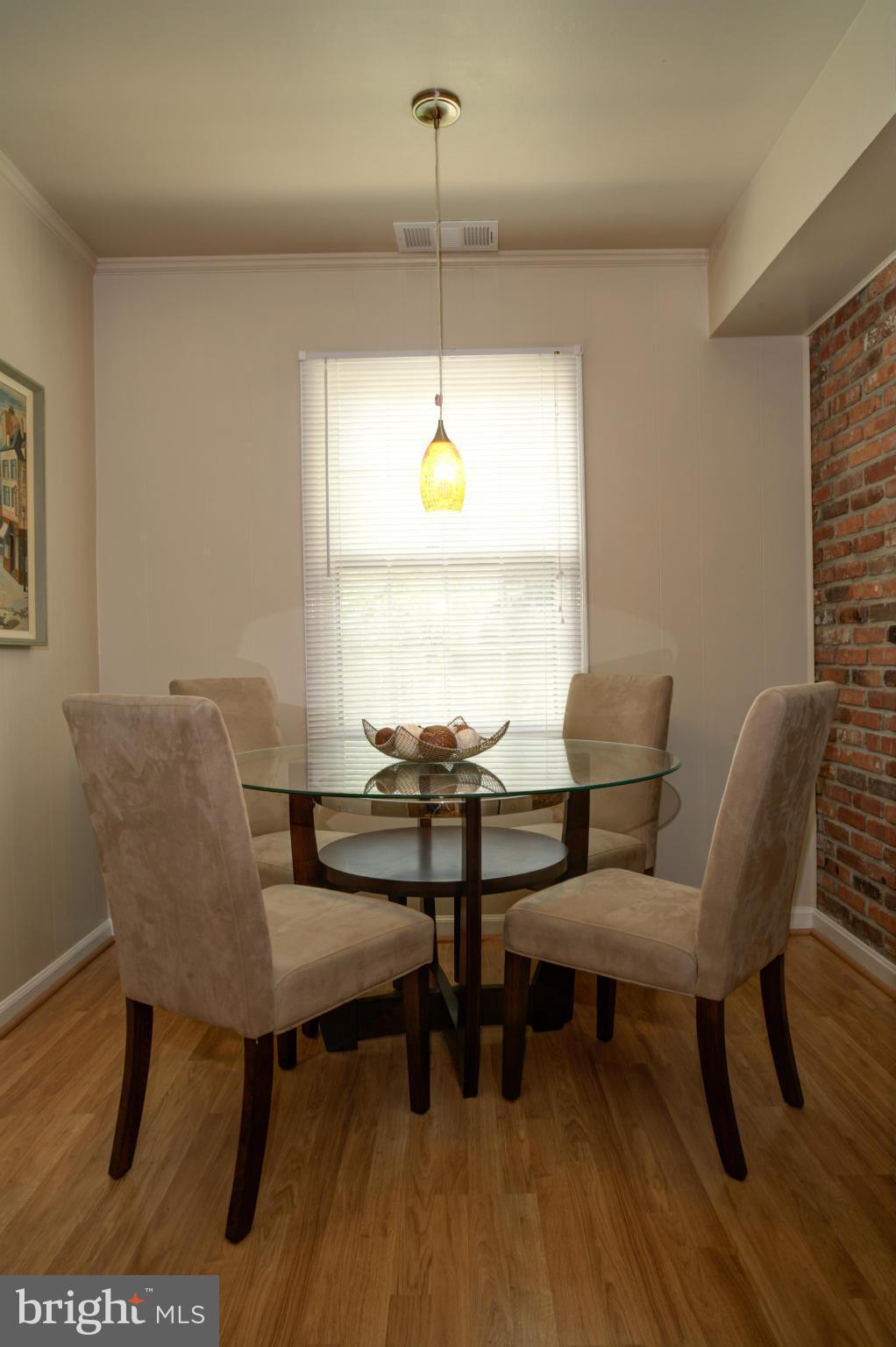 8129 Kingsway Court, Unit 283 Springfield, VA 22152 - Photo 9 of 22 a view of a dining room with furniture and window