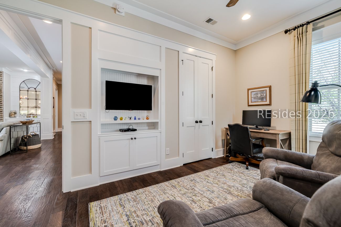 36 Oldfield Village Road Bluffton, SC 29909 - Photo 18 of 85 Downstairs den with built ins and storage closet