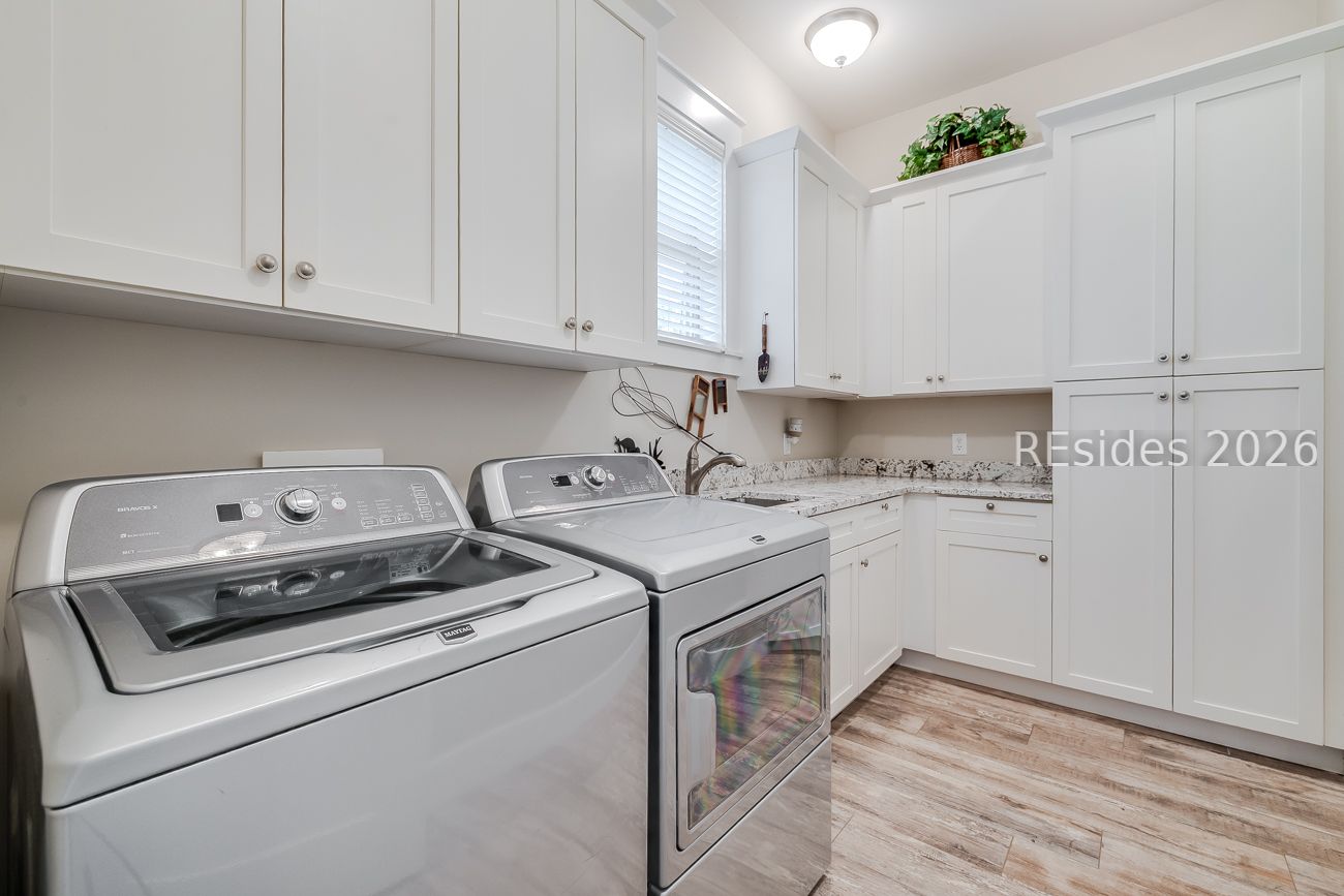 36 Oldfield Village Road Bluffton, SC 29909 - Photo 20 of 85 Laundry room with more cabinetry and sink