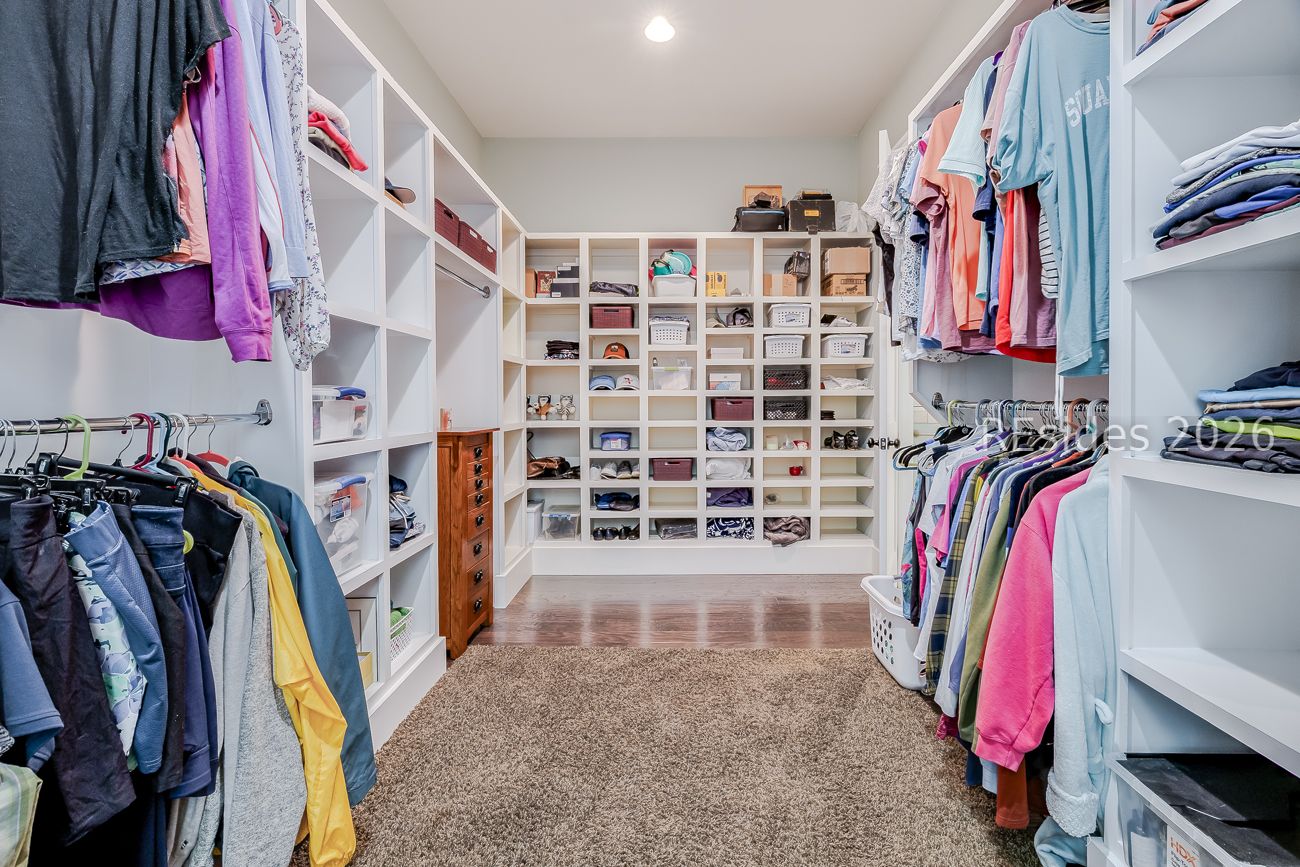 36 Oldfield Village Road Bluffton, SC 29909 - Photo 27 of 85 Large primary suite closet with wood built ins