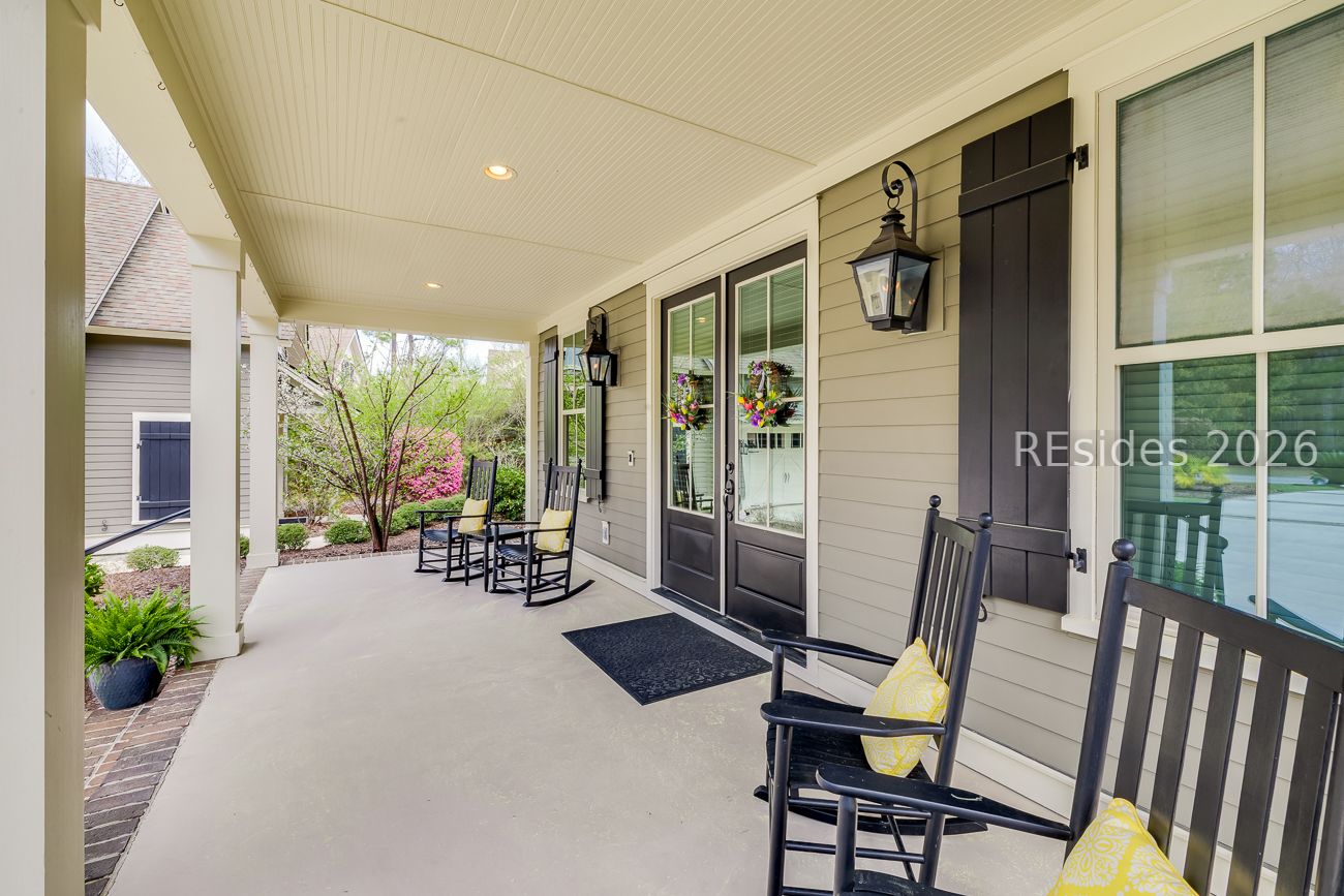 36 Oldfield Village Road Bluffton, SC 29909 - Photo 4 of 85 Rocking chair front porch with solid wood doors