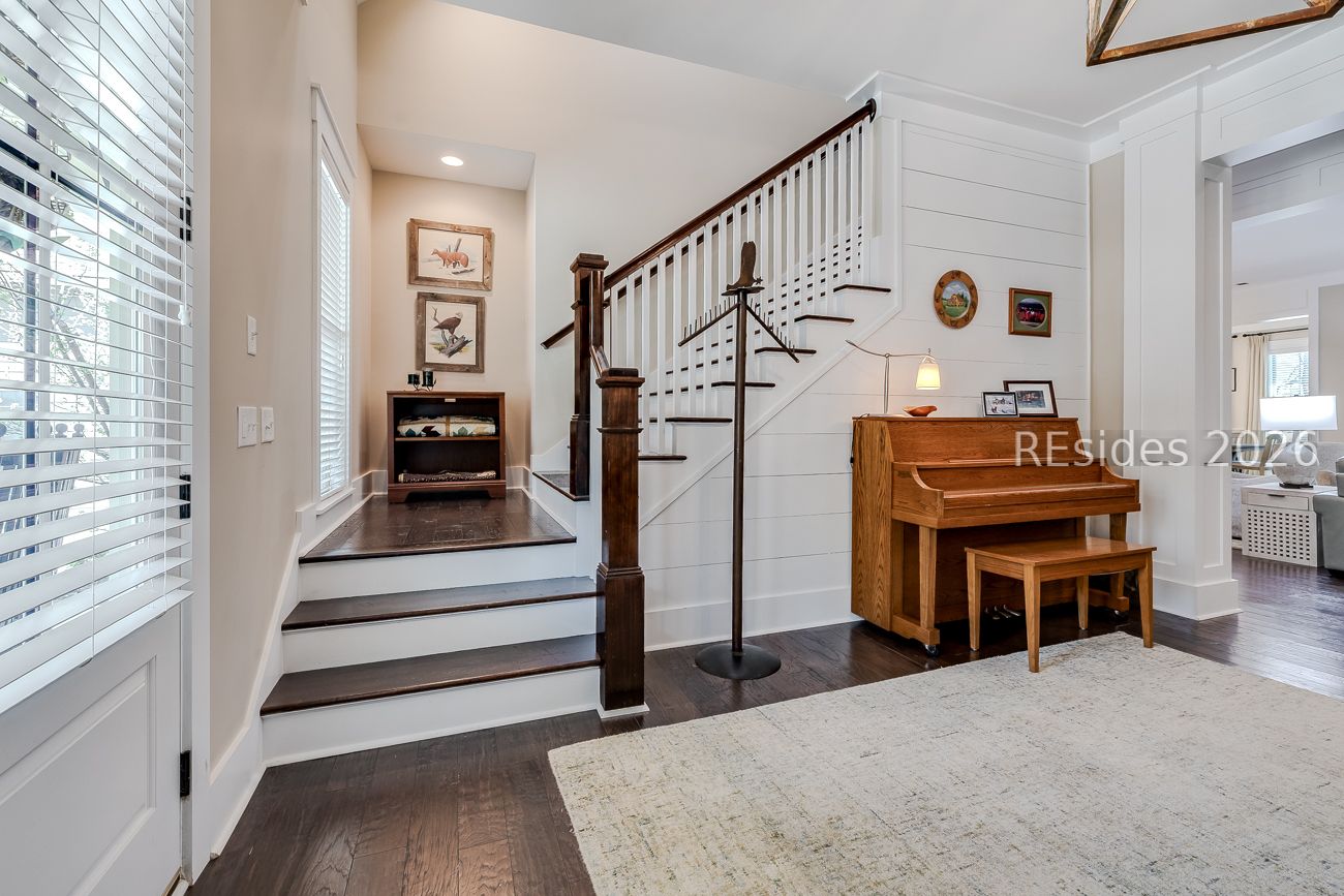36 Oldfield Village Road Bluffton, SC 29909 - Photo 7 of 85 Stairs to upper level with display nook
