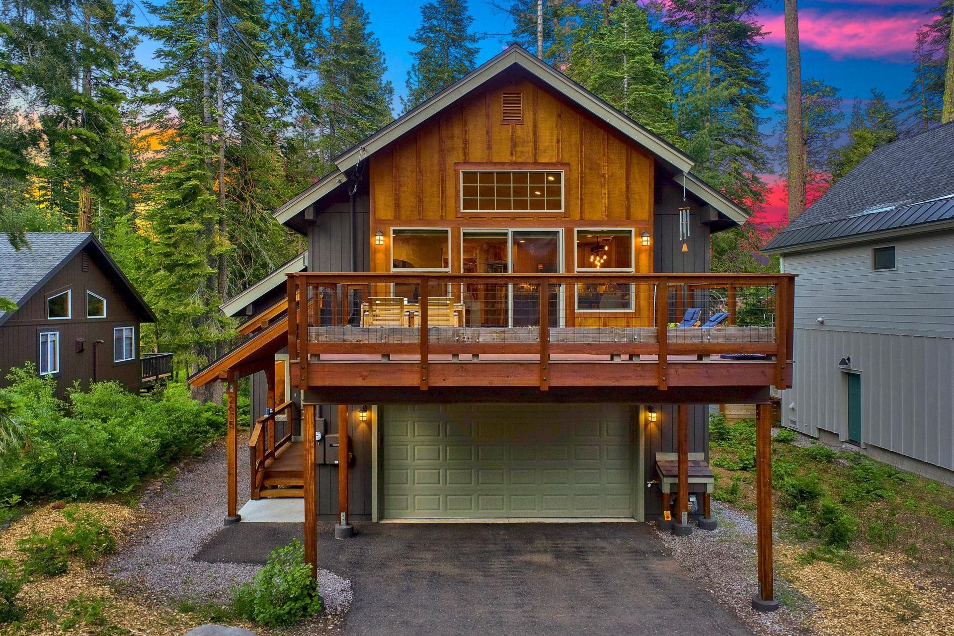 2675 Rustic Lane Tahoe City, CA 96141 - Photo 1 of 21 a view of a house with large windows and a small yard