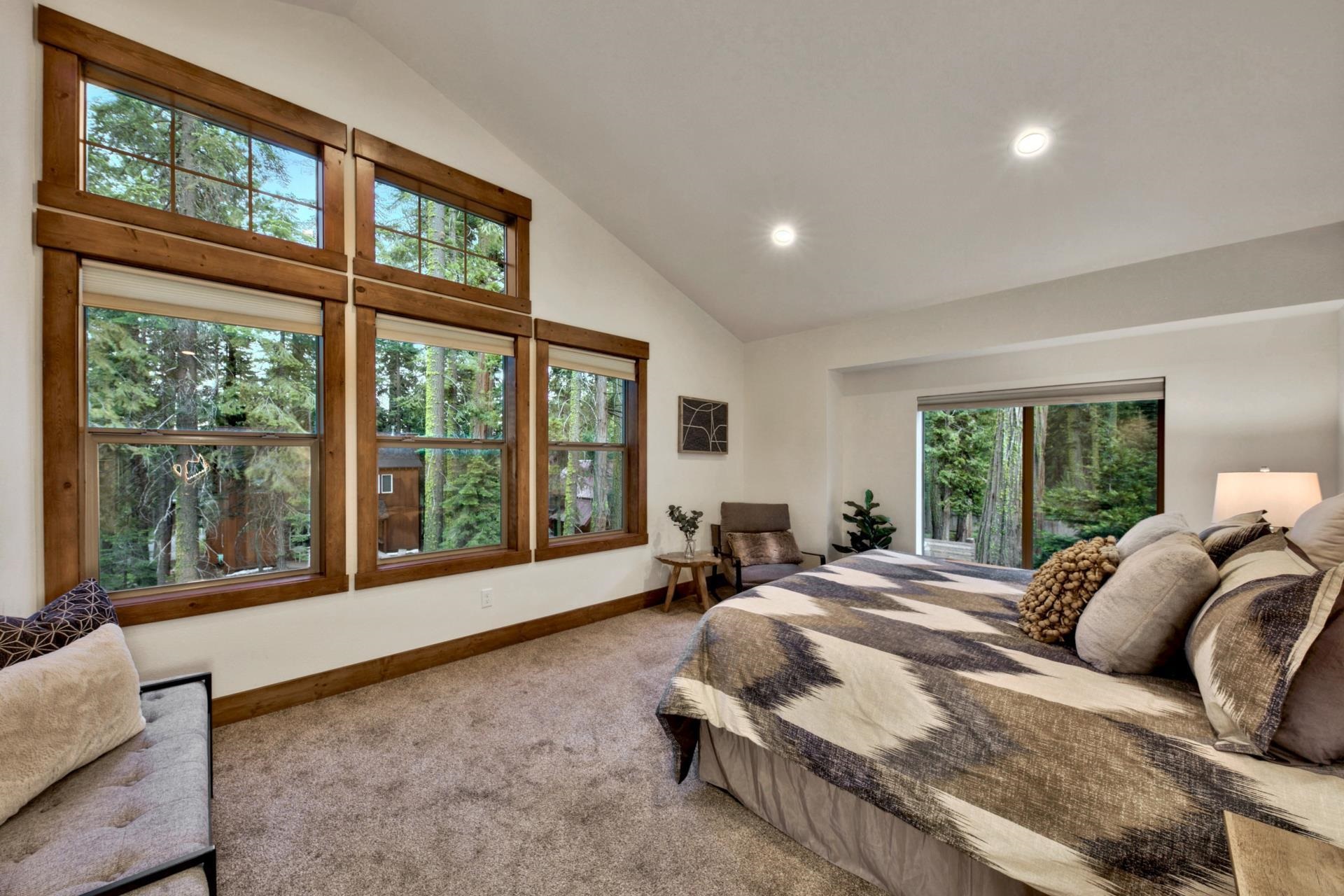 2675 Rustic Lane Tahoe City, CA 96141 - Photo 12 of 21 a bed sitting in a spacious bedroom next to a large window