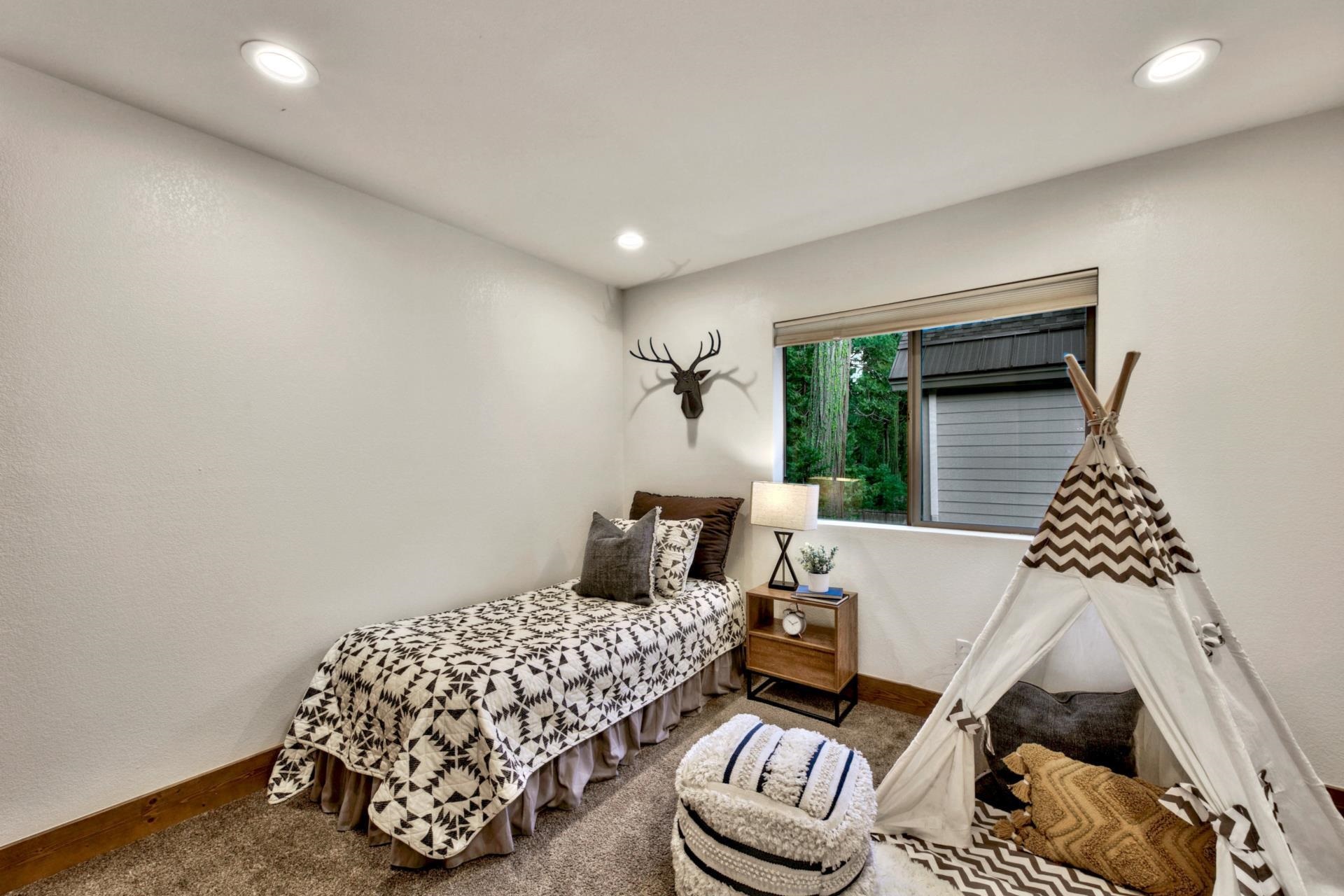2675 Rustic Lane Tahoe City, CA 96141 - Photo 15 of 21 a bedroom with furniture and a window