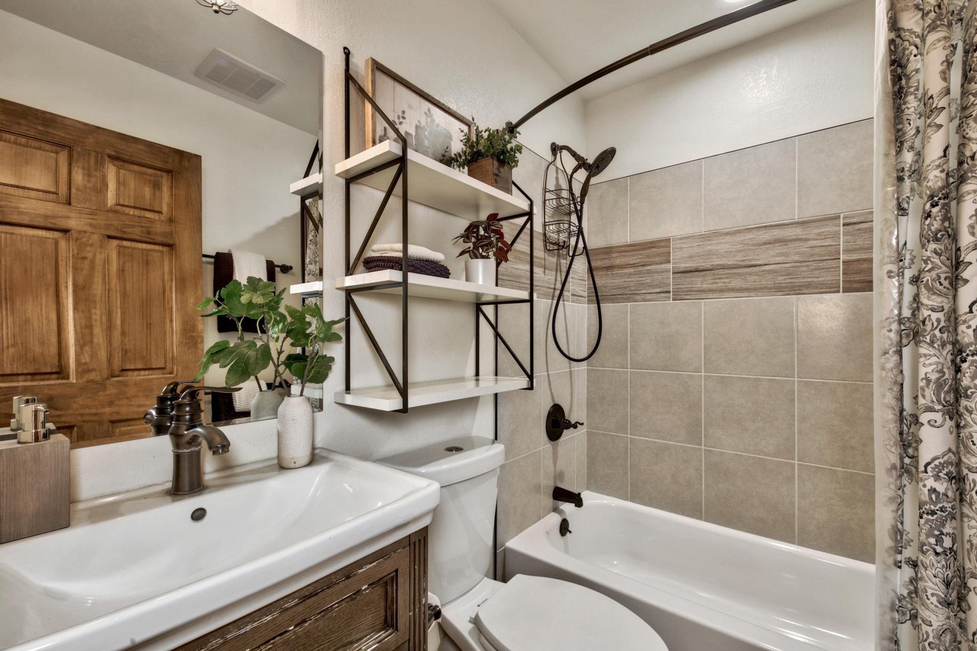 2675 Rustic Lane Tahoe City, CA 96141 - Photo 16 of 21 a bathroom with a sink a toilet and shower