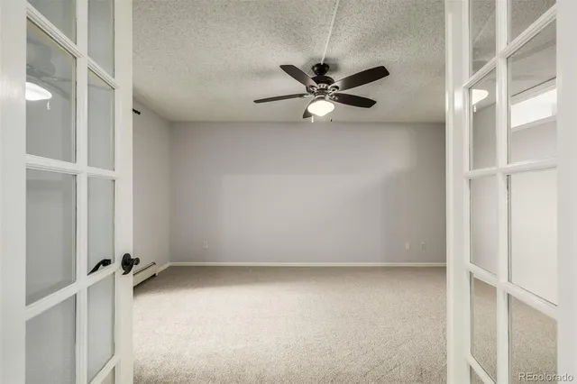 a view of an empty room with a window