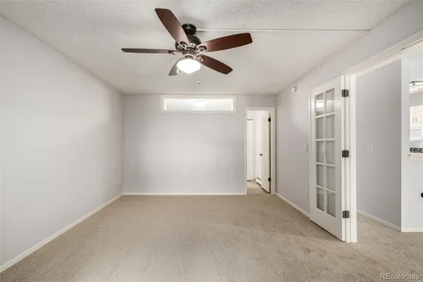 a view of an empty room with a window