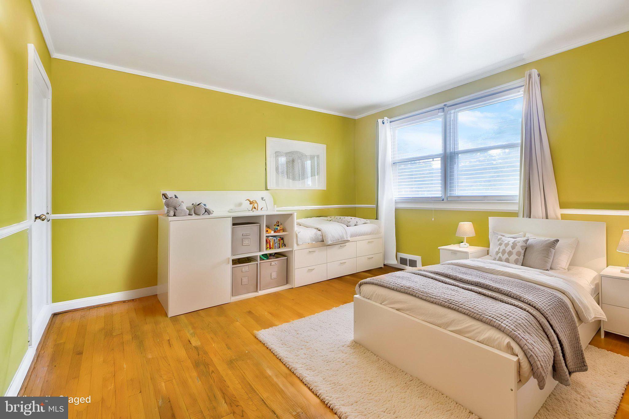 1903 Heathfield Road Baltimore, MD 21239 - Photo 17 of 30 a bed room with a bed and wooden floor