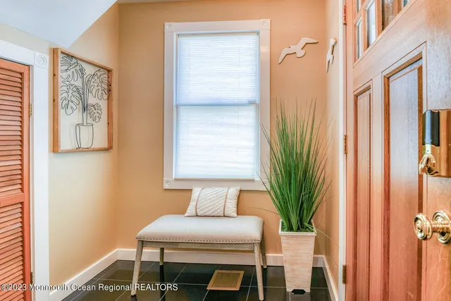 a bathroom with a sink a mirror and a window