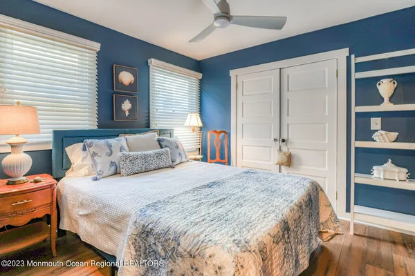 a bedroom with a bed and a closet