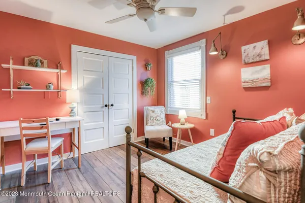 a bathroom with a sink mirror and shower