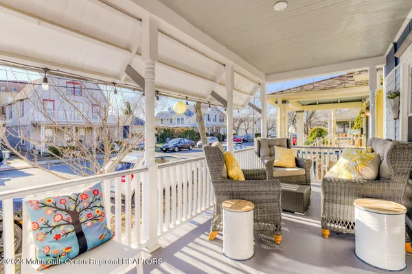 a outdoor living space with patio furniture and potted plants