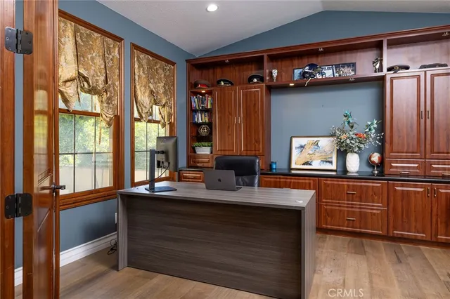 a living room with furniture fireplace and flat screen tv