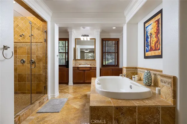 a spacious bedroom with a bed and a fireplace