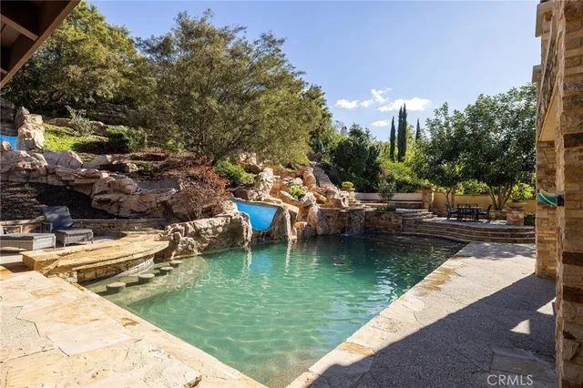 a backyard of a house with yard and outdoor seating