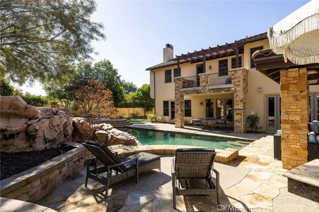 a view of yard with swimming pool and outdoor seating