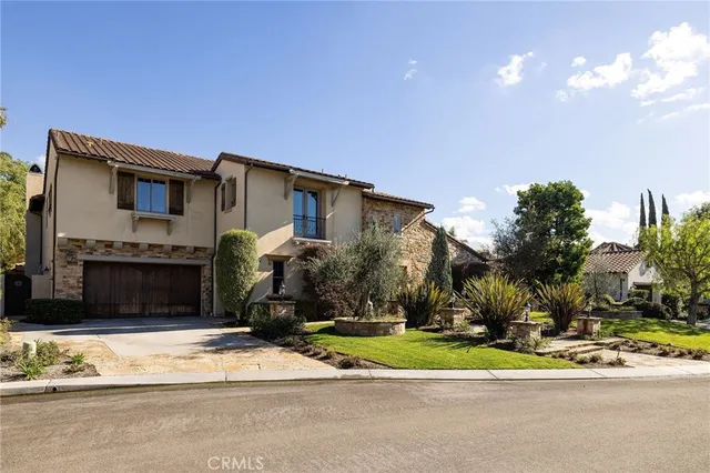 a view of a patio with table and chairs and potted plants