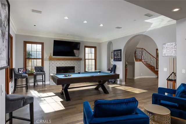 a living room with furniture fireplace and rug
