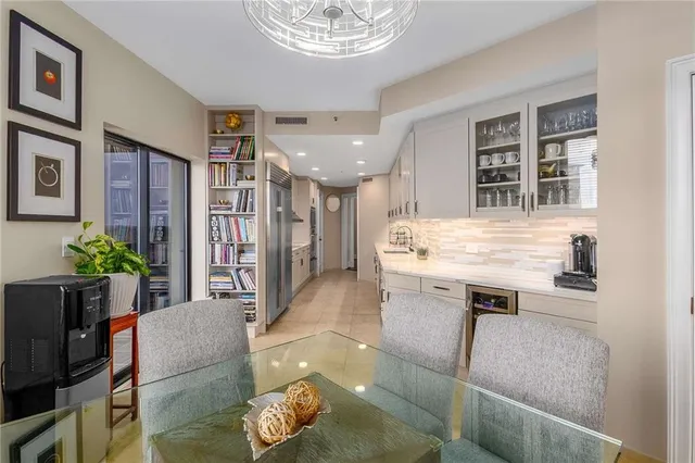 a living room with furniture and flowers