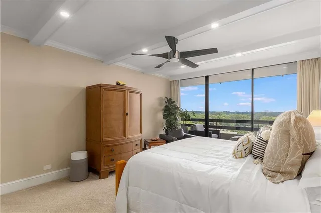 a spacious bedroom with a bed and a couch