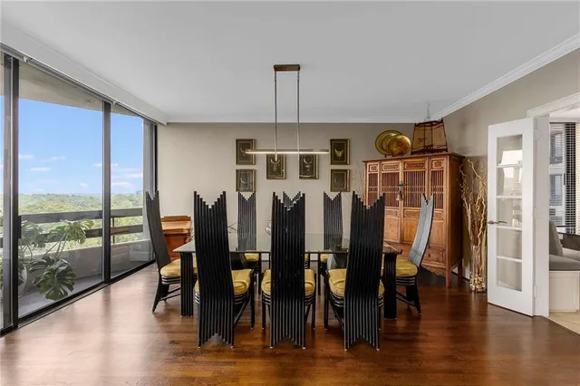 a view of a dining room with furniture window and wooden floor
