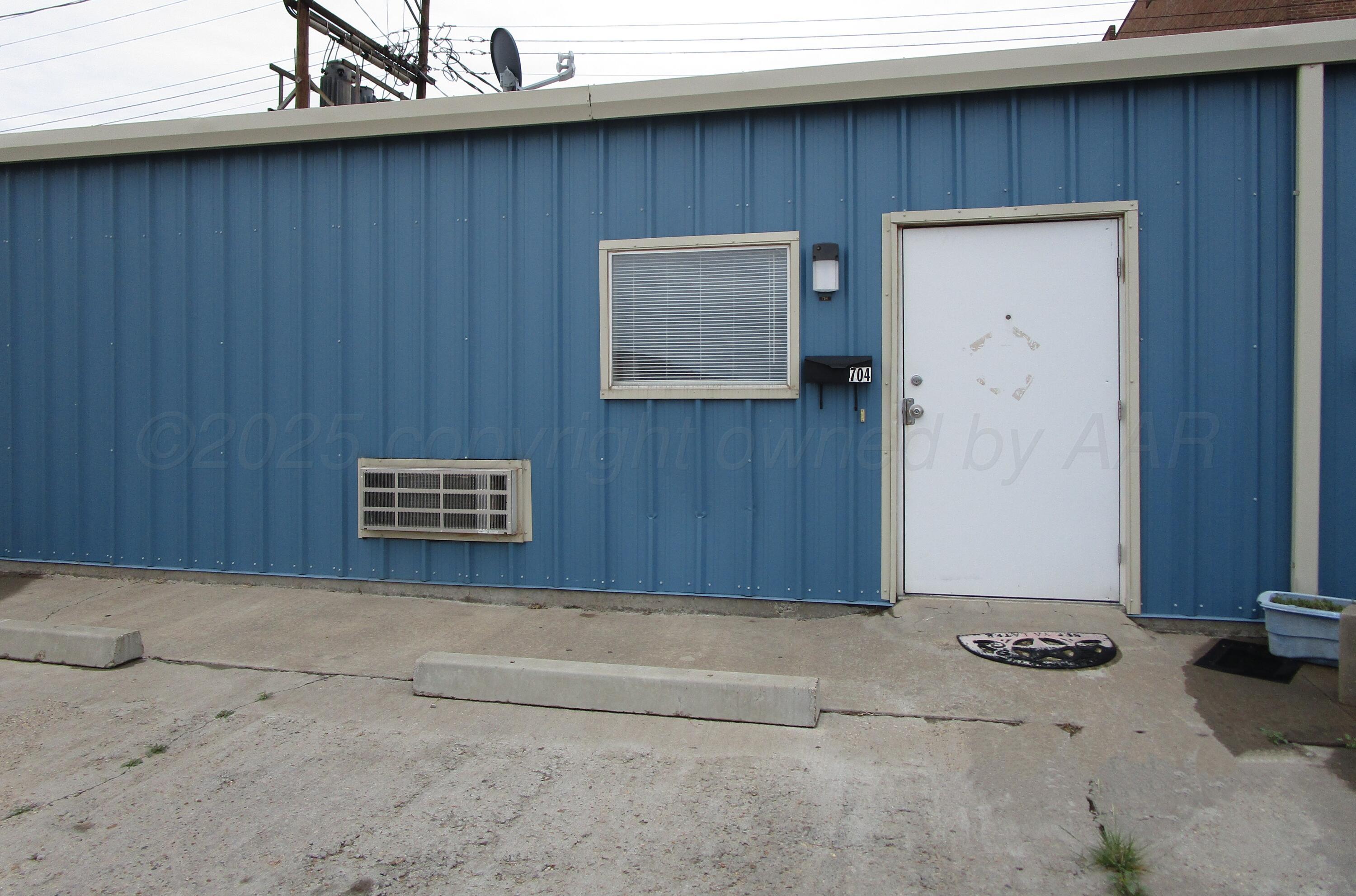 704 Deahl Street Borger, TX 79007 - Photo 1 of 8 a view of a door and wooden wall