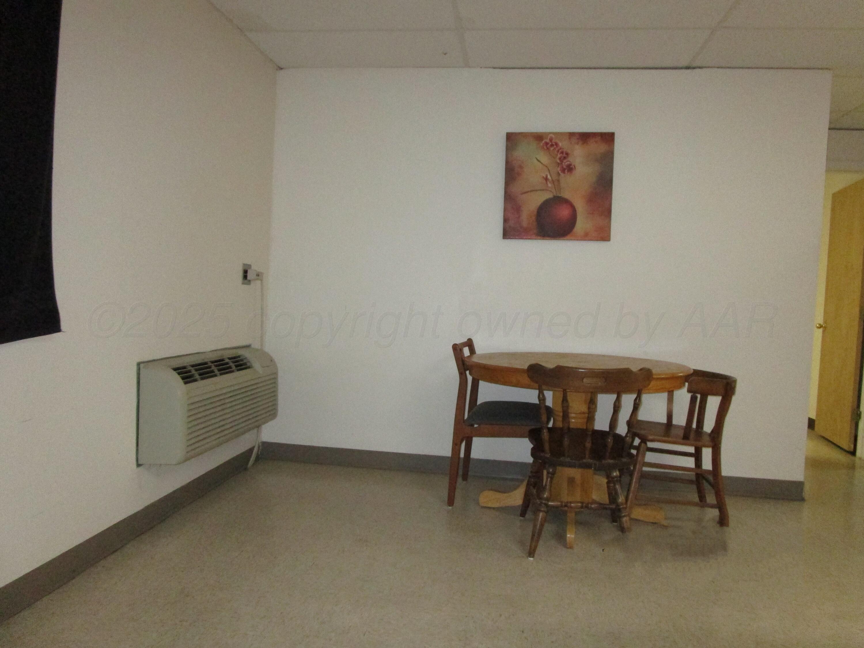 704 Deahl Street Borger, TX 79007 - Photo 4 of 8 a room with a chair and a couch