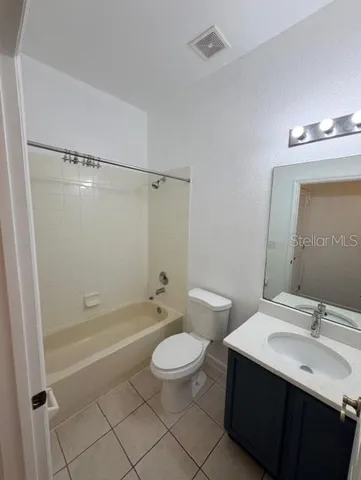 a view of an empty room and wooden floor