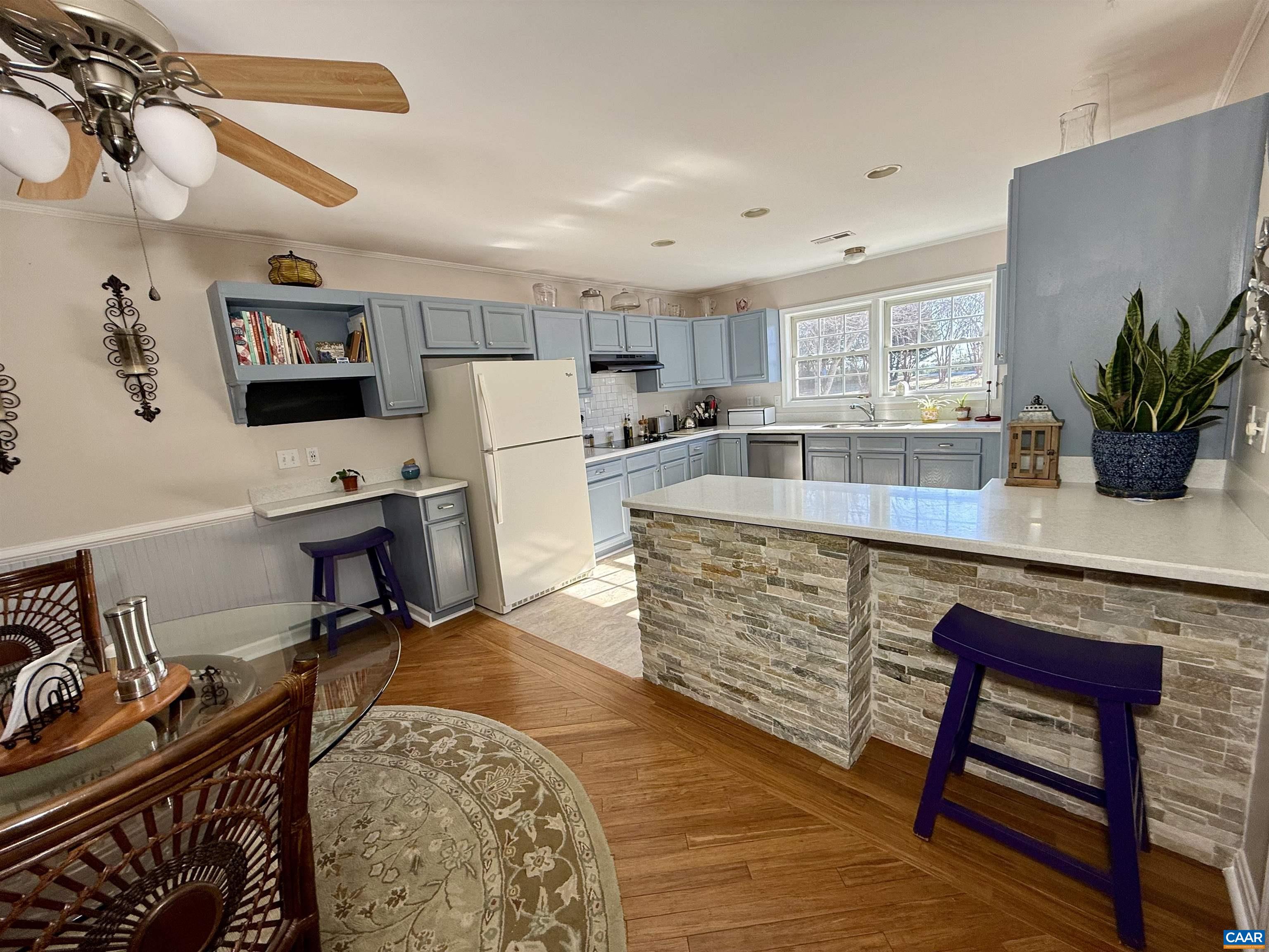 2019 Bybee Road Louisa, VA 23093 - Photo 14 of 47 a room with stainless steel appliances kitchen island granite countertop furniture and a wooden floor