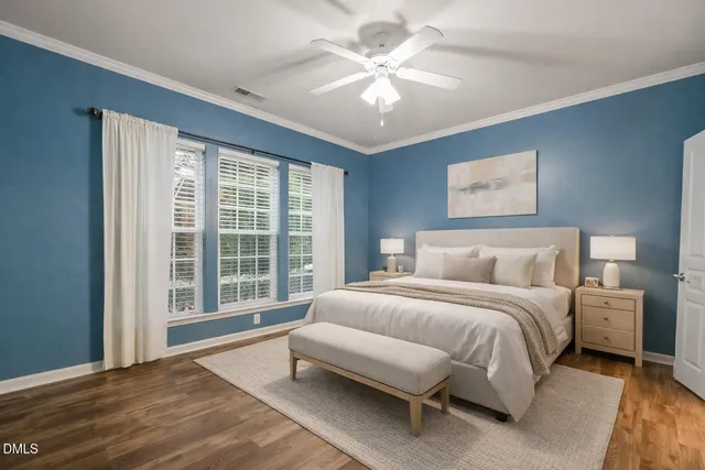 a view of a swimming pool with a yard and sitting area