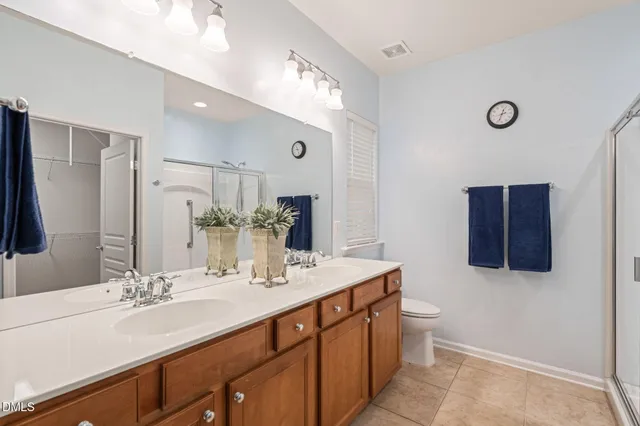 a living room with furniture a wooden floor and a large window