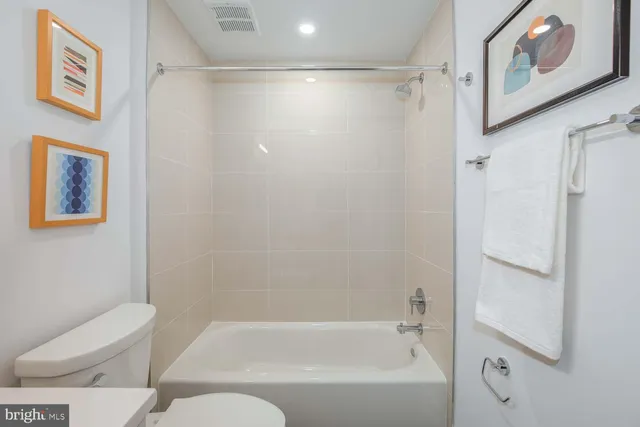 a bathroom with a bathtub and shower